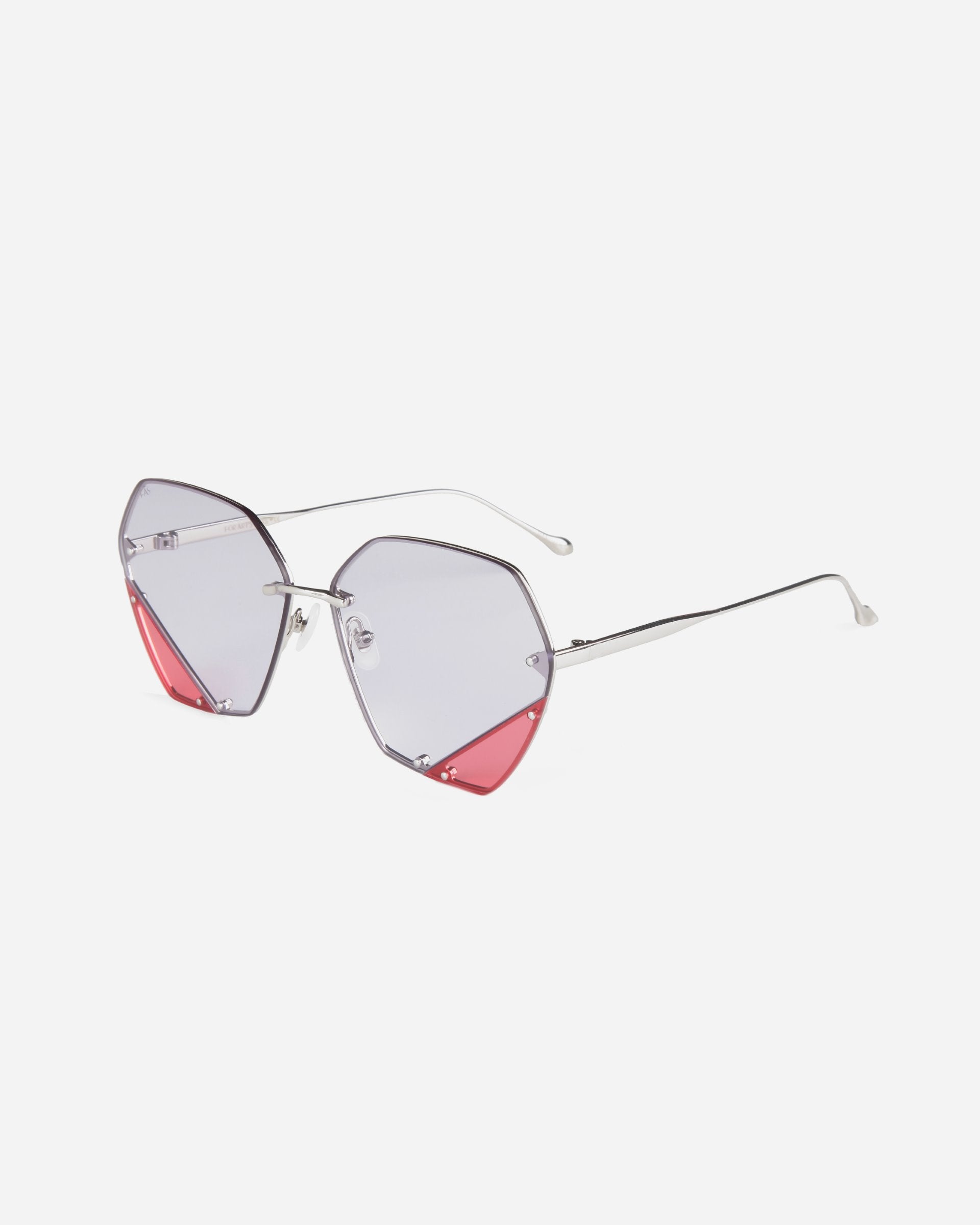 A pair of stylish, geometric For Art&#39;s Sake® Icy sunglasses with silver metal frames and gradient lenses, offering UV protection. The lenses are primarily blueish-gray with red tinting on the lower edges. The temples are thin and silver, extending to matching earpieces with jadestone nosepads. The background is white.