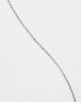 A close-up image of a For Art's Sake® Florentina Glasses Chain against a plain white background. The chain appears lightweight with small, round links, arranged diagonally across the image.