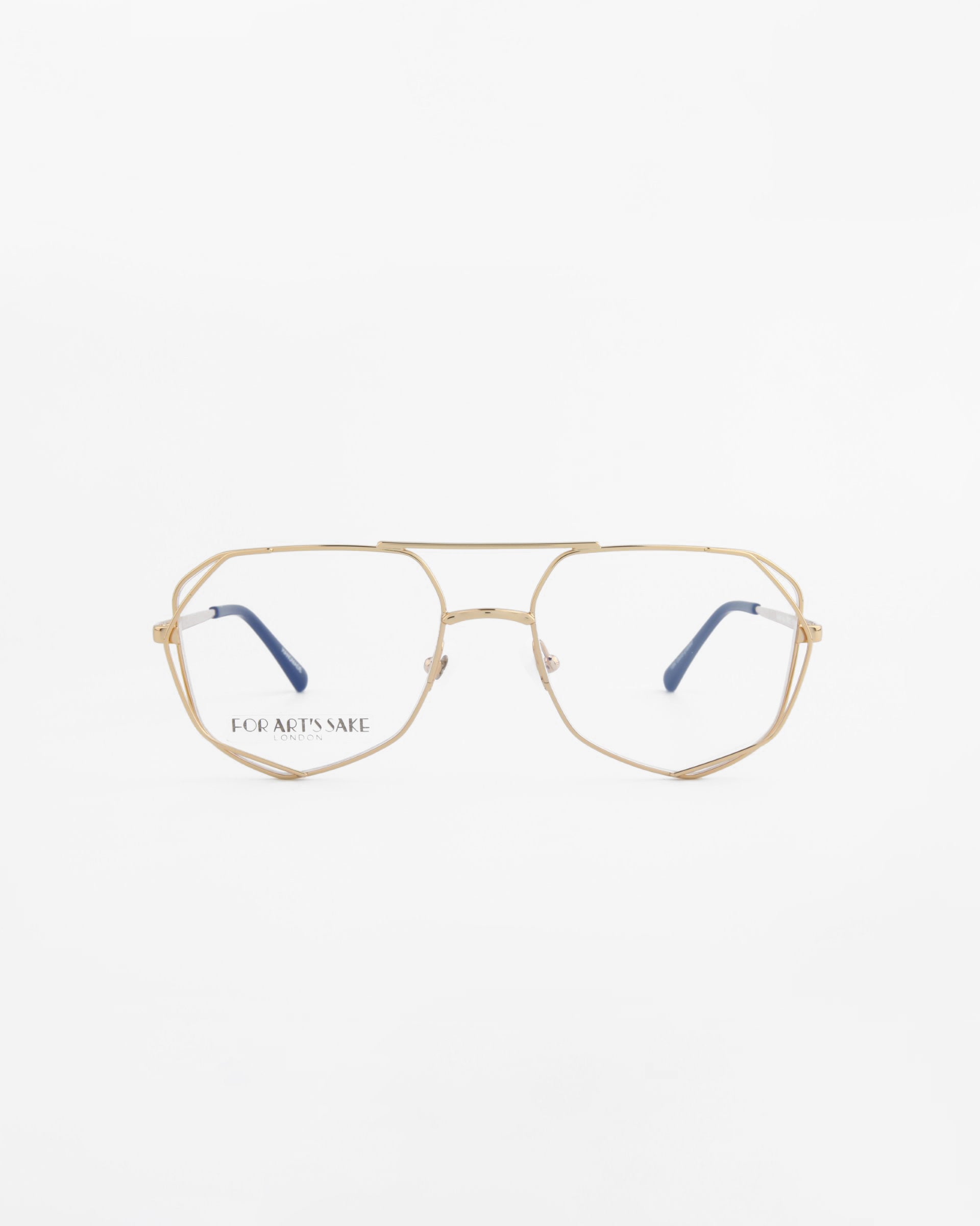A pair of aviator-style eyeglasses with a thin, gold metal frame and clear lenses is centered against a white background. The left lens bears the engraved text "For Art's Sake®" in gold, offering Genius Two Blue Light Filter for added comfort.