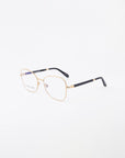 A pair of thin, 18-karat gold-plated eyeglasses displayed on a white background. The Grace glasses from For Art's Sake® have square lenses with black temple tips and small nose pads attached to the bridge for added comfort. One of the side arms is partially visible, showcasing a sleek black and gold design.