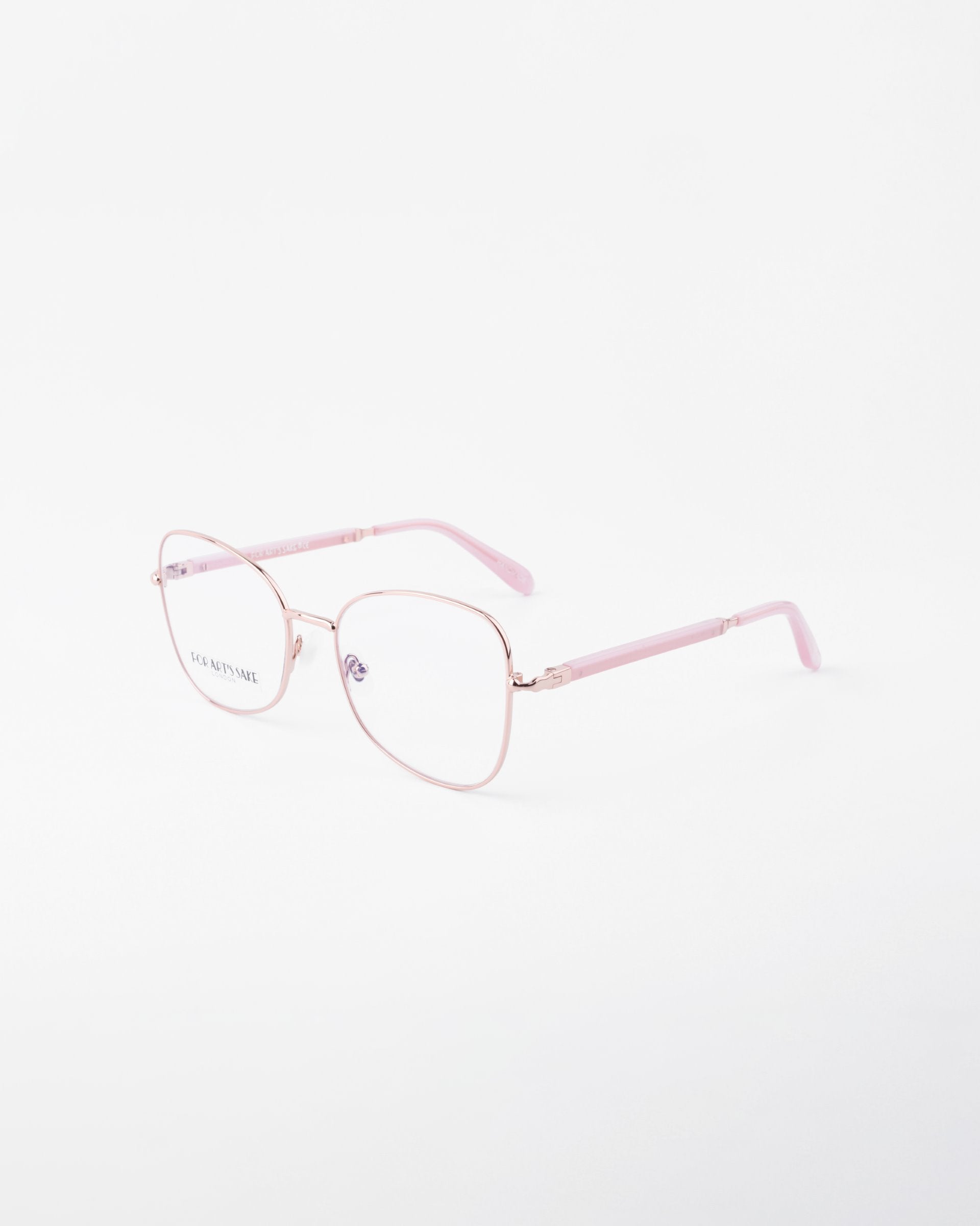 A pair of pink, metal-framed For Art&#39;s Sake® Grace prescription glasses with slightly oversized, rectangular lenses on a white background. The temples and temple tips are also pink, featuring clear nose pads and an 18-karat gold-plated brand logo visible on the left lens.