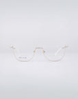 A pair of thin-rimmed eyeglasses with gold wireframes and blue light filter lenses, beautifully known as Greta frames from For Art's Sake®, are displayed against a light gray background.