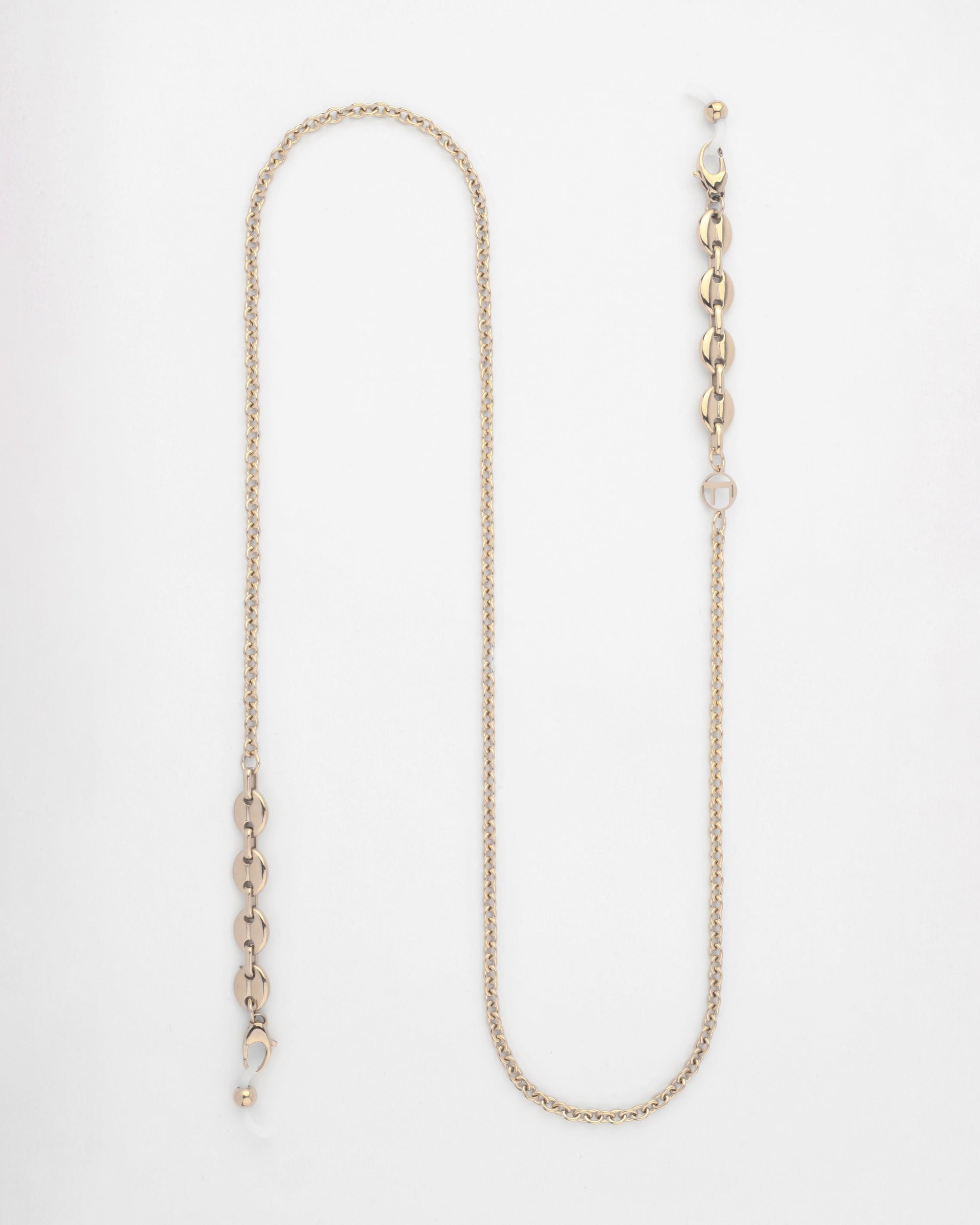 A For Art&#39;s Sake® Hackney Glasses Chain laid out in an S-shape against a white background. The chain features a series of interconnected oval links on one end and a small clasp on the other, accented with a stylish freshwater pearl detail.