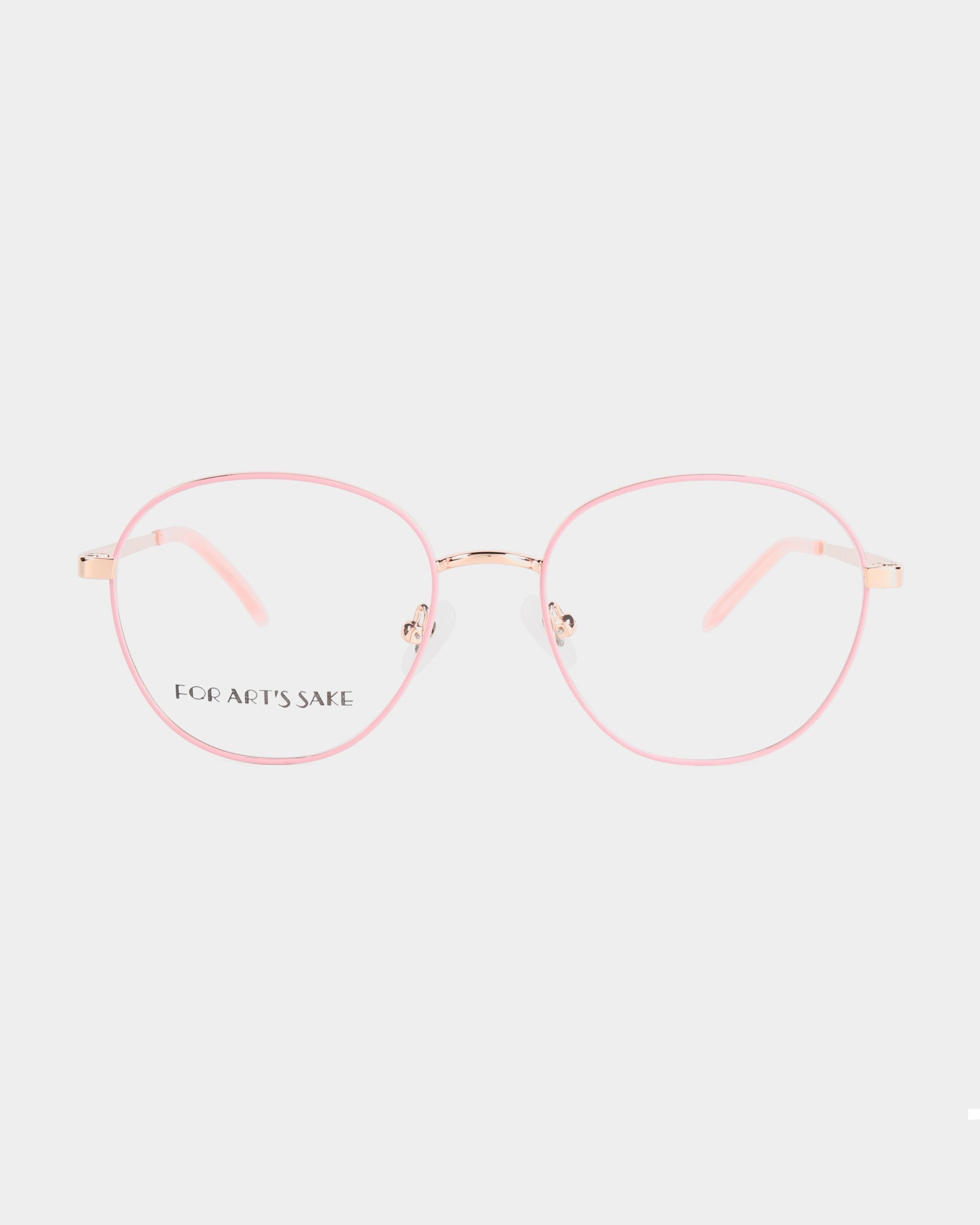 A pair of pink-rimmed eyeglasses with clear lenses on a white background. Featuring a metal frame, these glasses have a slight cat-eye shape and soft pink accents on the adjustable nose pads and temple tips. The left lens has the brand name "For Art's Sake®" visible. Introducing the Hailey by For Art's Sake®.