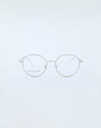 The Hope Silver eyeglasses by For Art's Sake® are delicate, round-framed unisex glasses with a lightweight build and thin metallic rims, set on a plain white background. They boost comfort and style with subtle hinges and nose pads.