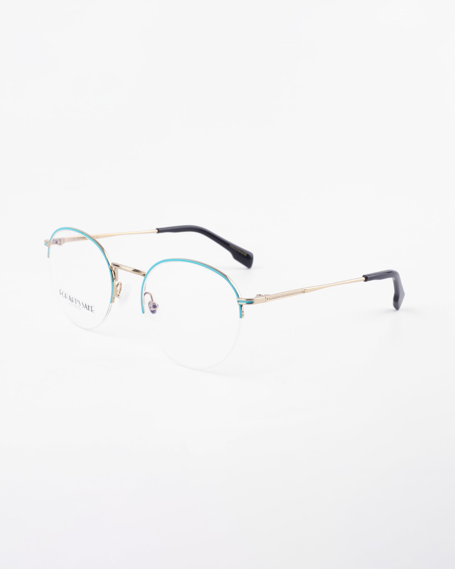 A pair of thin, gold-framed eyeglasses with rimless, prescription lenses. The temples have black plastic tips, and there is a subtle touch of blue on the upper part of the lenses for a blue light filter. The For Art&#39;s Sake® Ivy glasses are displayed on a white background.