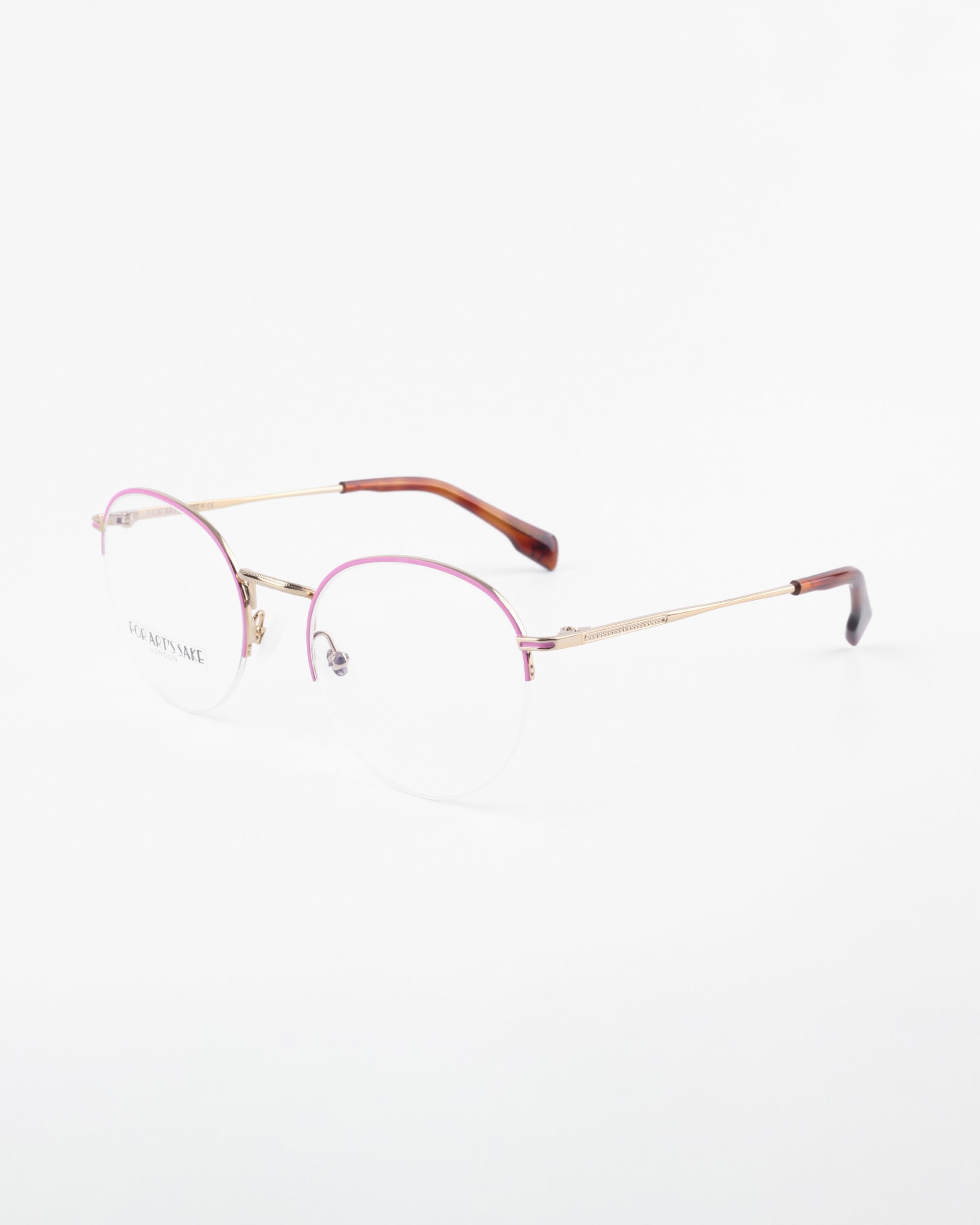 Here is the sentence with the specified product name and brand name:

A pair of For Art&#39;s Sake® Ivy minimalist eyeglasses with thin gold frames and subtly tinted pink upper rims. The temples are gold with brown tips. Featuring clear prescription lenses with a blue light filter, the overall design is sleek and modern against a plain white background.