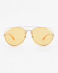 A pair of aviator-style For Art's Sake® Casino sunglasses with yellow-tinted, nylon lenses and thin, metallic frames. The arms of the sunglasses are also yellow and have a sleek design. They offer UV protection and the image features a white background.