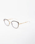 A pair of stylish eyeglasses with thin 18-karat gold-plated frames, black detailing around the lenses, and a twisted design on the earpieces. Featuring a Blue Light Filter, these For Art's Sake® Julie glasses are displayed on a white background and angled slightly to the left.