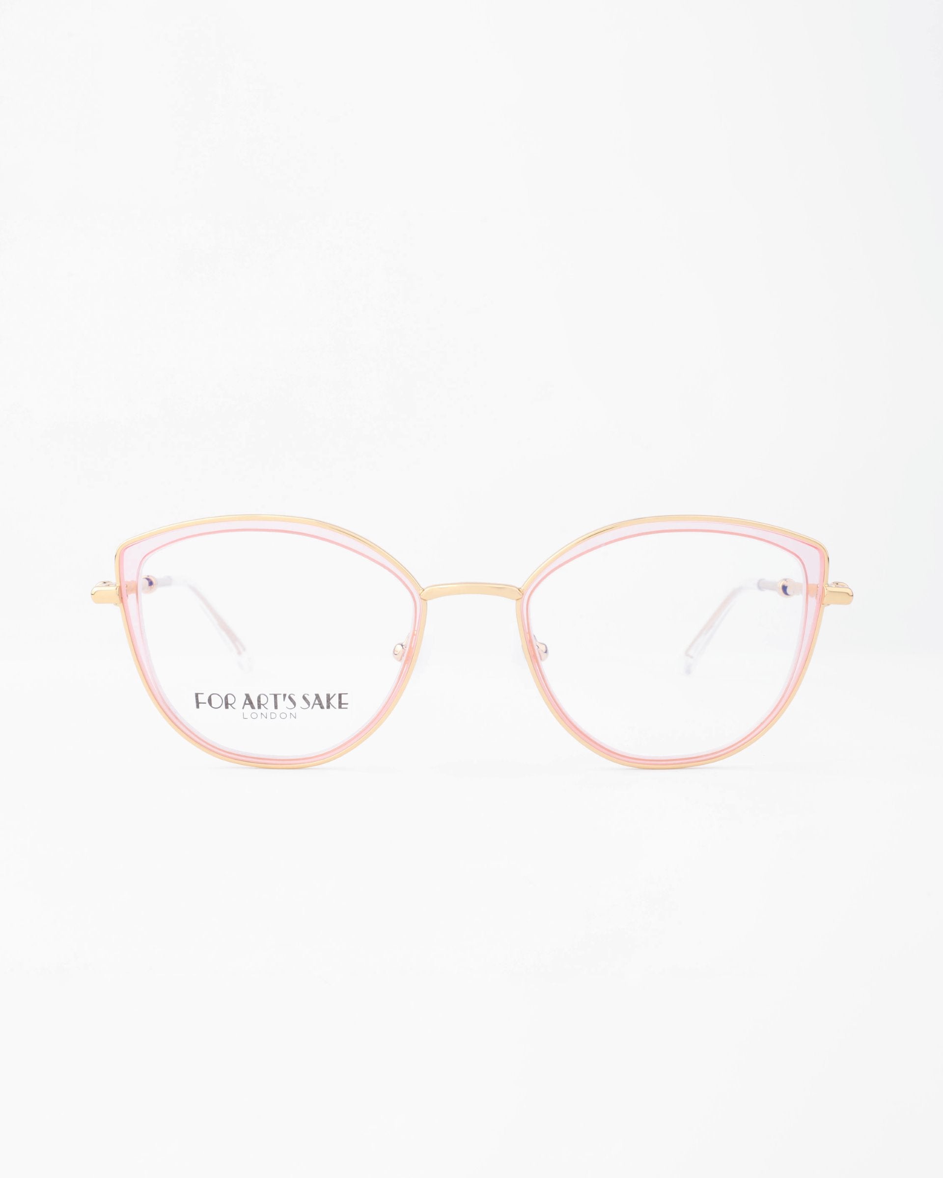 A pair of fashionable eyeglasses with thin, 18-karat gold-plated frames and light pink accents around the lenses. The left lens has "FOR ART'S SAKE®" printed in black on it. These stylish glasses, which come with a blue light filter option, are displayed against a plain white background.