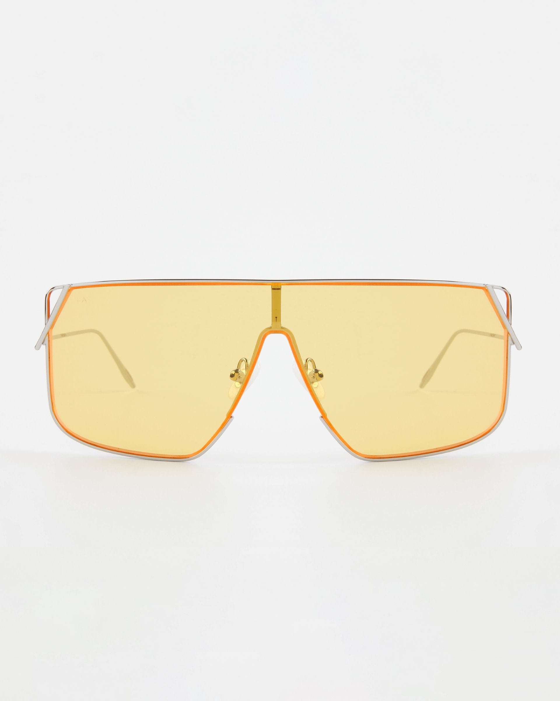 A pair of Horizon sunglasses from For Art's Sake® with large, yellow-tinted lenses. The lenses are enclosed in a thin, orange frame featuring a gold-tone bridge and adjustable nose pads. Slim stainless steel arms complement the bold design, while offering UVA & UVB protection for your eyes.