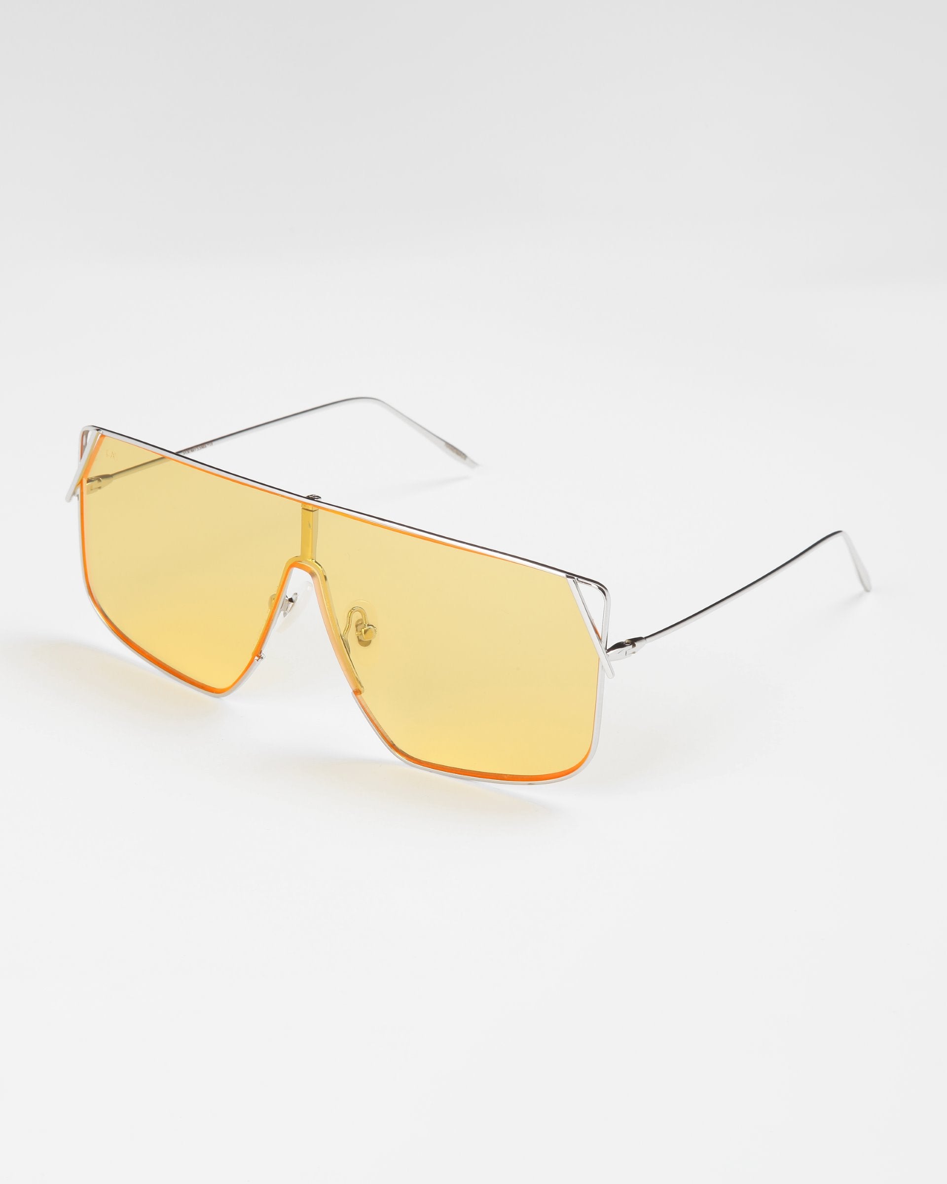 A pair of For Art&#39;s Sake® Horizon sunglasses with a stainless steel frame and large, rectangular yellow-tinted lenses is displayed against a plain white background. The design features a bridge bar, thin temple arms, and adjustable nosepads for added comfort.