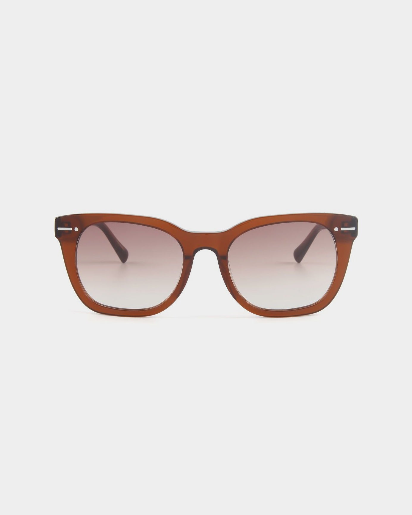 A pair of brown, square-framed Jacuzzi with gradient nylon lenses displayed against a plain white background. The classic and slightly retro frame, crafted from Mazzucchelli acetate, features subtle details near the hinges and provides full UVA & UVB protection by For Art's Sake®.