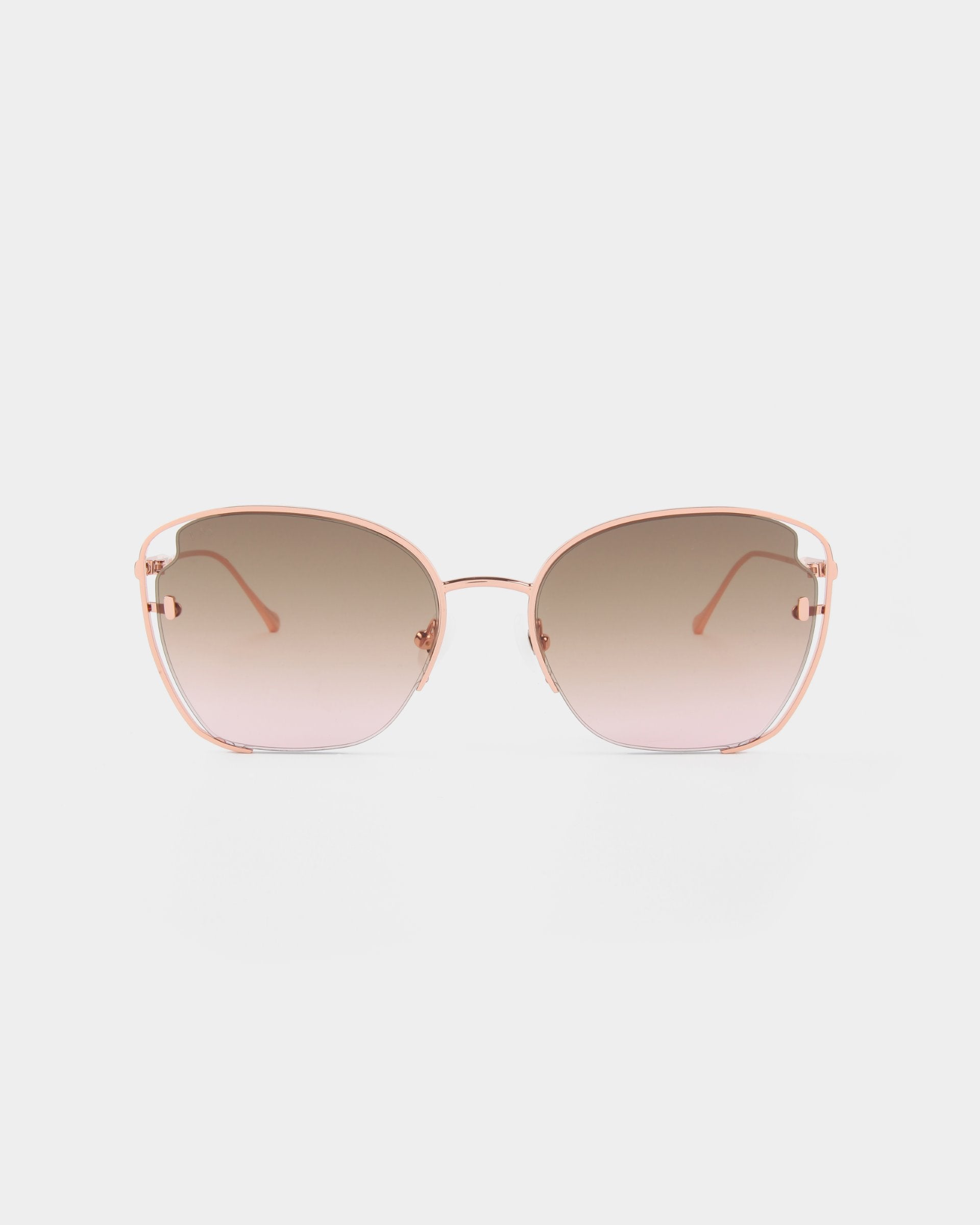 A pair of For Art&#39;s Sake® Eden sunglasses with a thin, 18-karat gold plated rose gold frame and gradient brown lenses, offering UVA &amp; UVB protection, set against a white background.