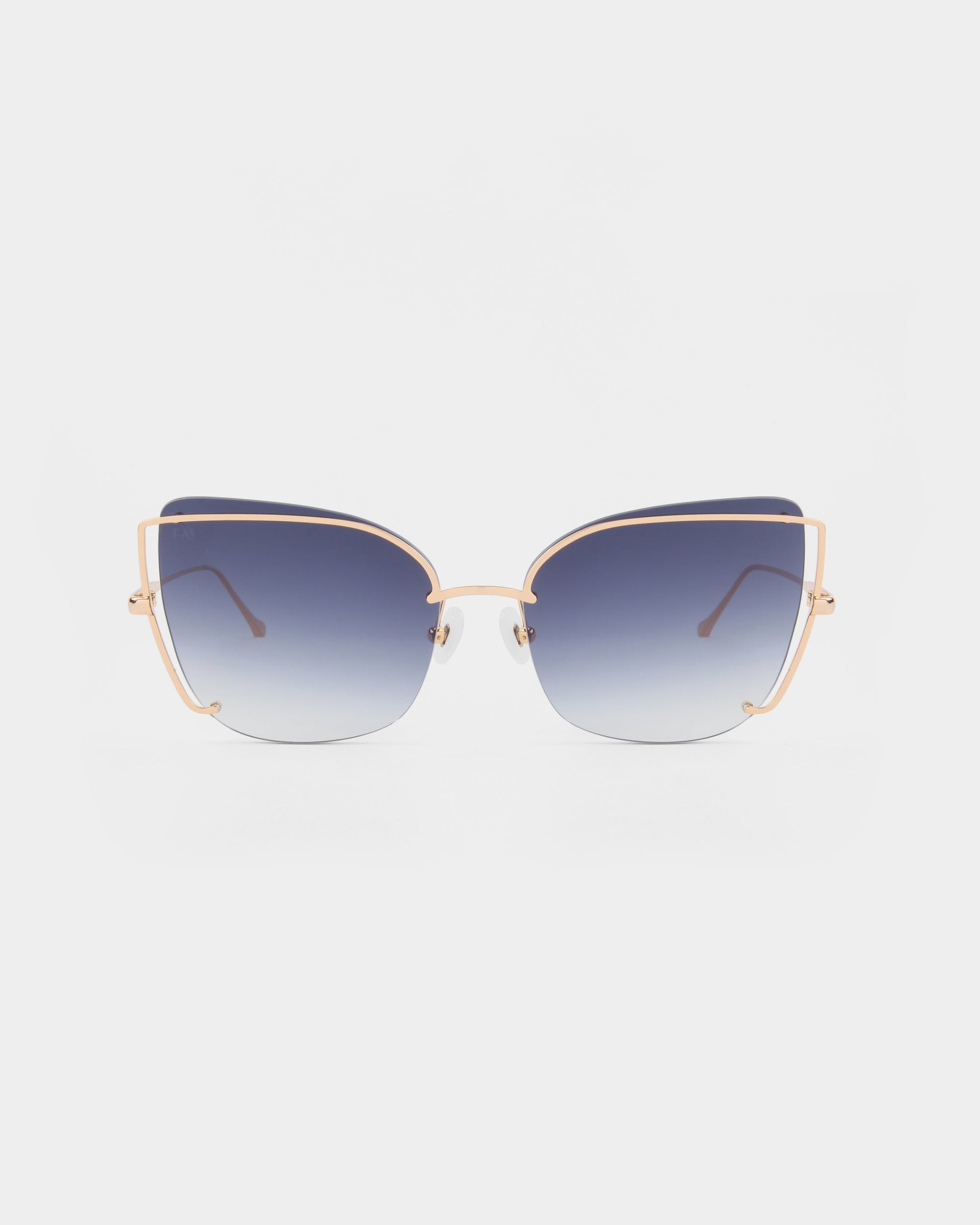 Introducing &quot;Meow&quot; by For Art&#39;s Sake®: A pair of stylish sunglasses featuring gold-colored stainless steel frames and blue gradient nylon lenses. This modern and chic design includes a prominent top bridge, adjustable nosepads, and unique hinge details. The product is presented against a plain white background.