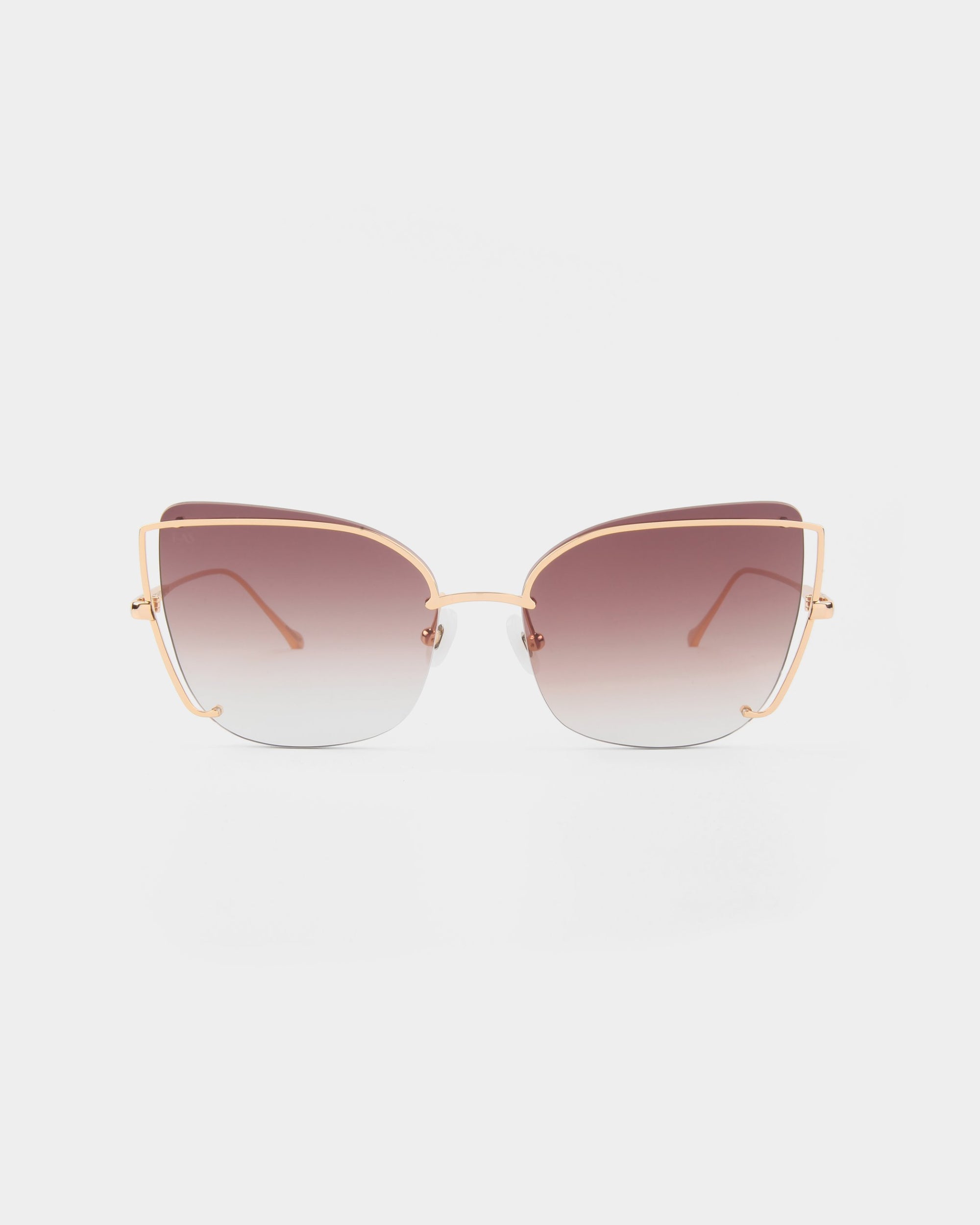 A pair of stylish Meow cat-eye sunglasses by For Art&#39;s Sake®, featuring 18-karat gold-plated thin metal frames and gradient brown-tinted lenses that provide UVA &amp; UVB protection, set against a plain white background.