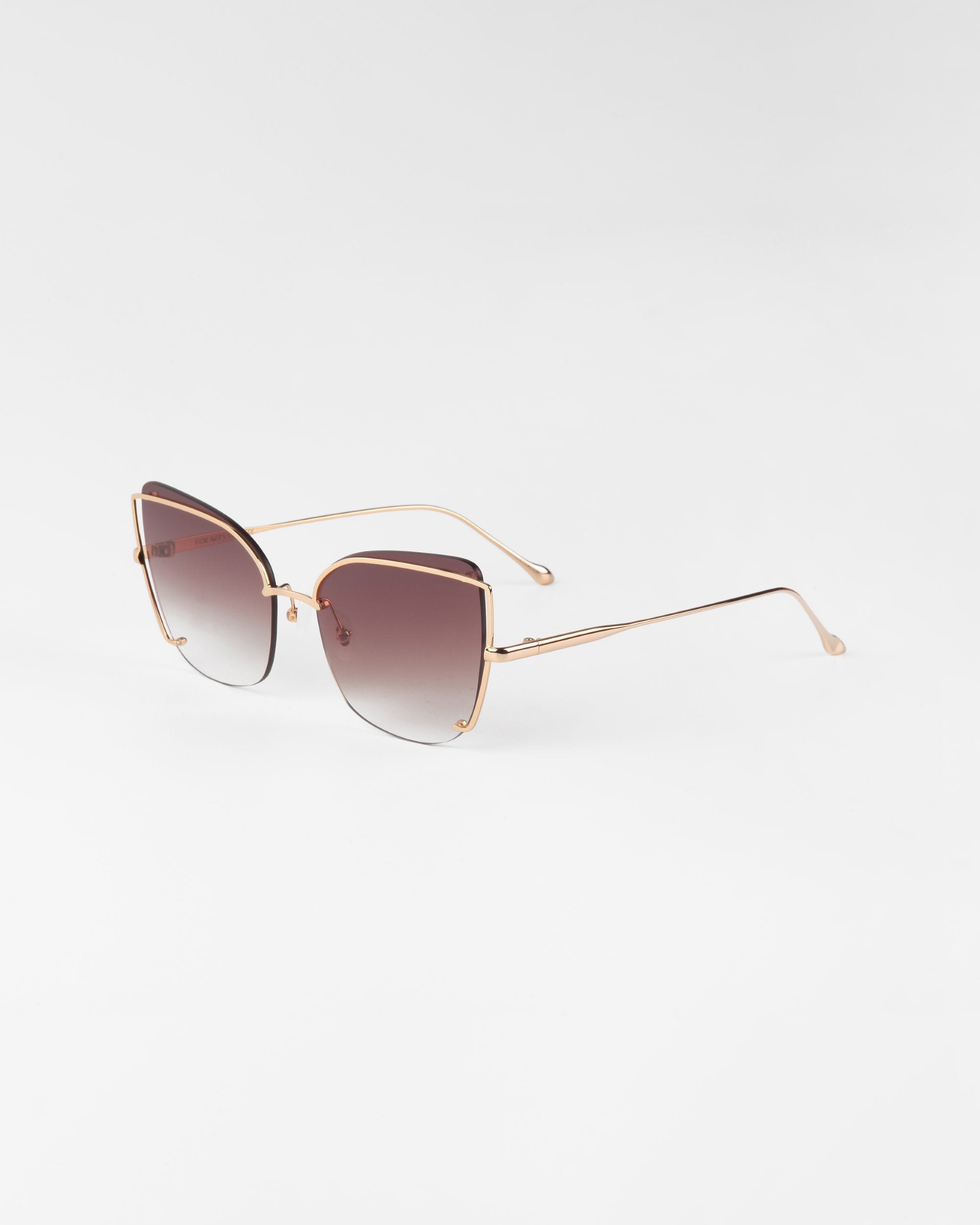 Introducing the Meow by For Art&#39;s Sake®: These classy oversized sunglasses feature sleek, gold-plated frames and gradient lenses that shift from dark at the top to light at the bottom. The straight arms are also gold-plated and elegantly curve at the ends, making for a sophisticated and stylish accessory.