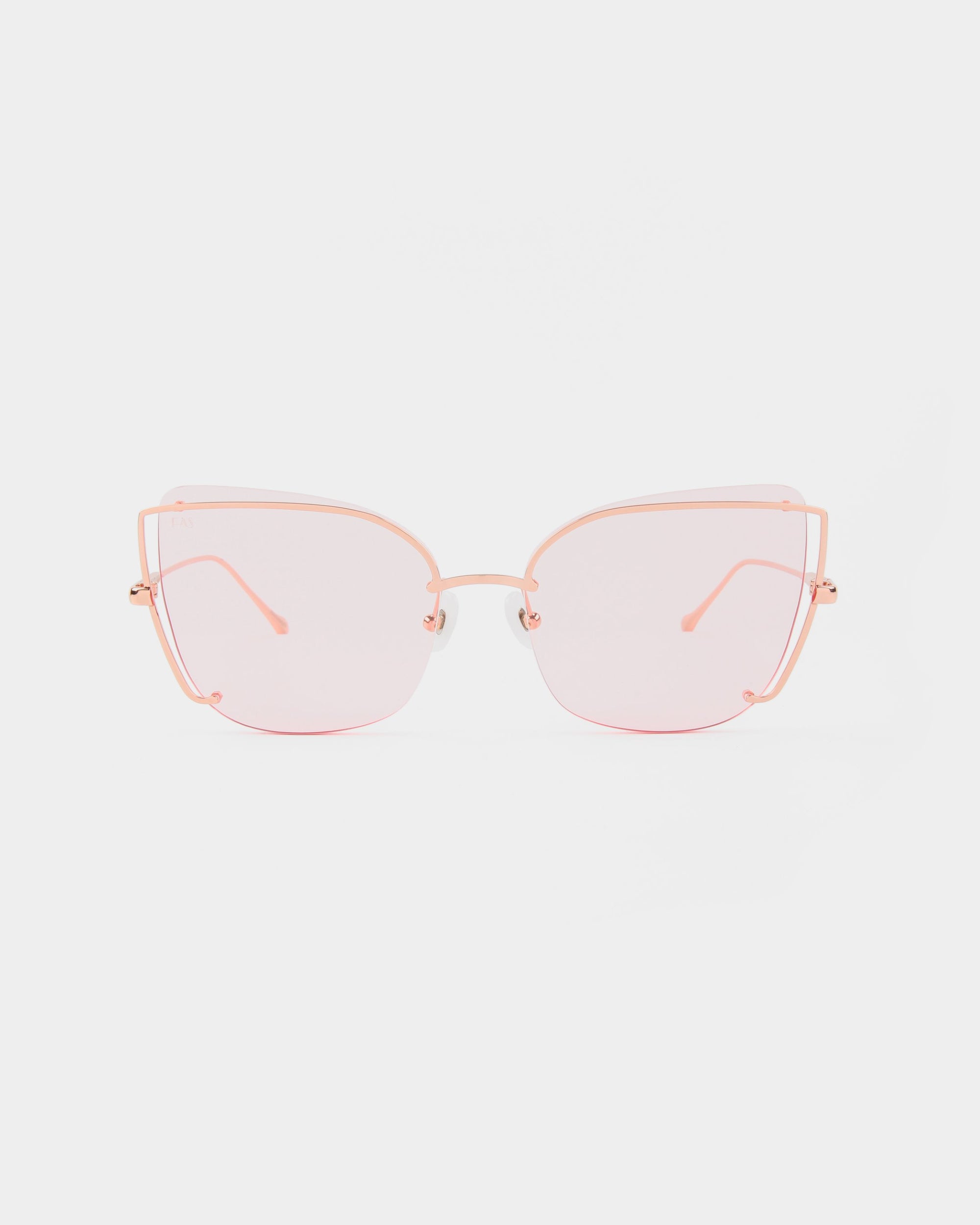 The Meow sunglasses by For Art&#39;s Sake® are stylish, oversized cat-eye frames featuring tinted pink nylon lenses. The thin, delicate stainless steel frames have a light pink metallic finish, and adjustable nosepads ensure a perfect fit. This modern and chic design is sure to turn heads.