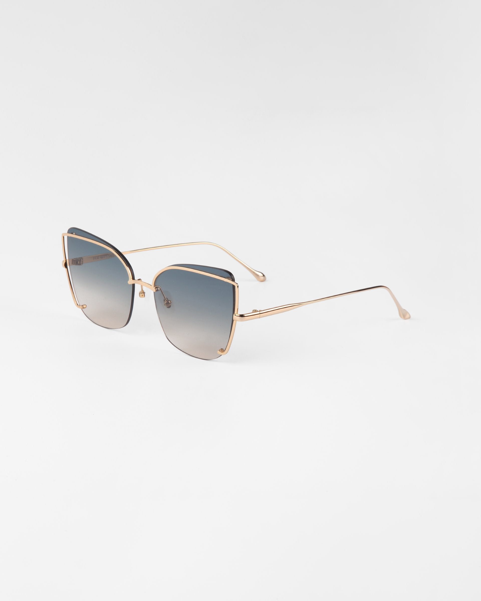 Combining contemporary flair with elegance, these Meow sunglasses from For Art&#39;s Sake® feature a chic cat-eye design enhanced by gradient lenses that seamlessly transition from dark at the top to lighter at the bottom. The thin gold metal frames and refined temples complete their stylish appeal.