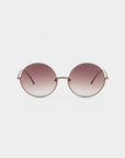 A pair of Oceana round sunglasses by For Art's Sake® with stainless steel frames and gradient nylon lenses transitioning from dark purple at the top to light pink at the bottom, offering UVA & UVB protection, displayed against a plain white background.