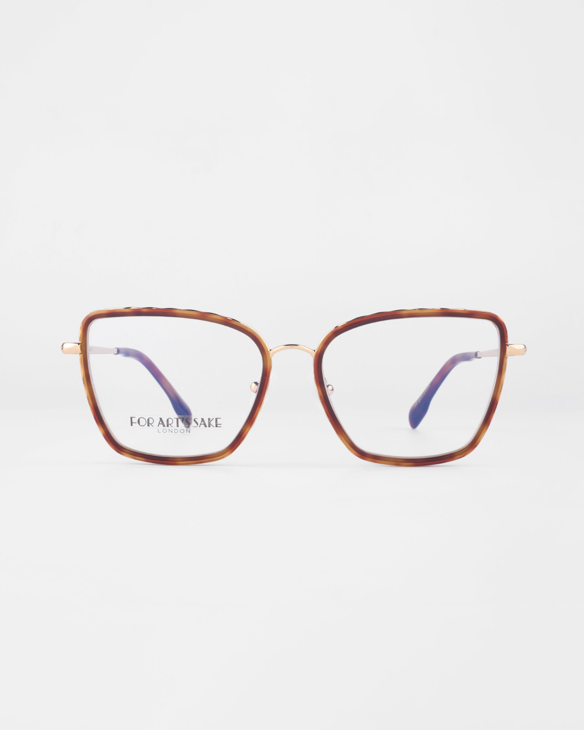 A pair of brown, large, square-rimmed glasses with gold-colored arms and purple inner tips. The transparent lenses showcase the brand text "For Art's Sake®" on the left lens. Featuring 18-karat gold-plated frames, the Lace glasses are positioned against a plain white background.