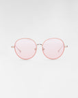 A pair of round Lemon sunglasses by For Art's Sake® with a thin, light pink metal frame and pink-tinted lenses against a white background. Featuring jadestone nose pads, the minimalist design gives a stylish and modern appearance.