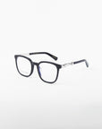 A pair of Molten by For Art's Sake® black-rimmed eyeglasses with square lenses is displayed on a white background. These prescription eyewear glasses feature metallic accents on the temples, adding a touch of style and elegance to the design.
