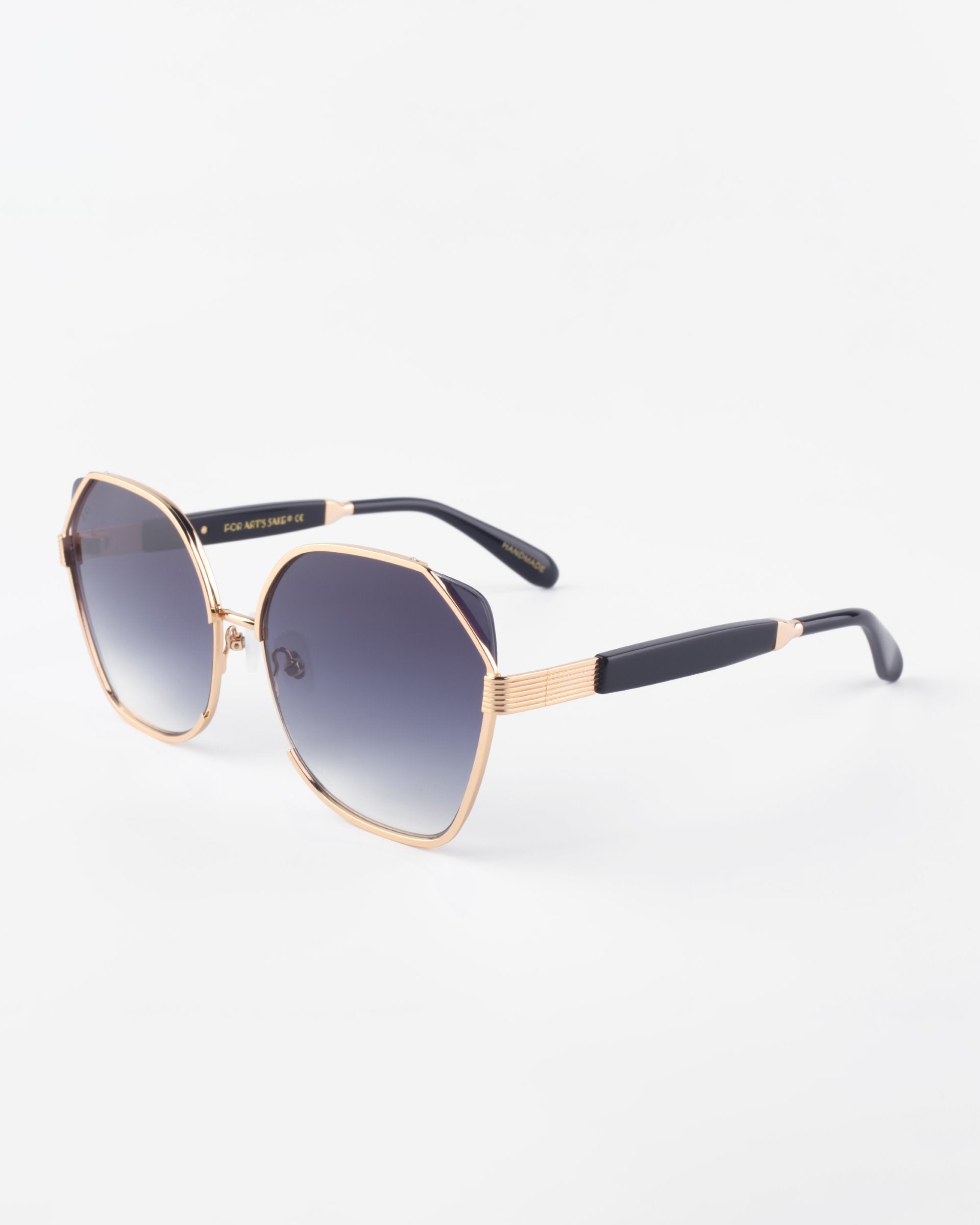 A pair of stylish Montage sunglasses with a gradient from dark to light, ultra-lightweight Nylon lenses. The gold-plated stainless steel frames feature black accents on the temples, exuding modern luxury and 100% UVA &amp; UVB protection, with subtle engravings on the sides by For Art&#39;s Sake®.