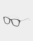 A pair of eyeglasses with black rectangular frames and silver temples is shown against a plain white background. The For Art's Sake® Morris glasses, featuring stainless steel frames, have clear lenses and small silver dots on the front edges near the hinges.