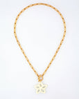 The Plumeria Necklace by For Art's Sake® features a gold chain with elongated rectangular links and a white butterfly-shaped pendant. Measuring 49cm in length, the necklace allows the pendant to hang elegantly at the center of the chain, displayed in a circular form against a white background.