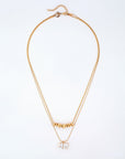 Introducing the Nora Necklace by For Art's Sake®: A delicate double-layered masterpiece showcased on a pristine white background. The upper layer is adorned with a row of dainty gold triangular charms, while the lower layer features a pendant with two square crystals set side by side. This elegant necklace boasts a thin gold chain complete with an adjustable clasp and extension chain for versatile length adjustments.