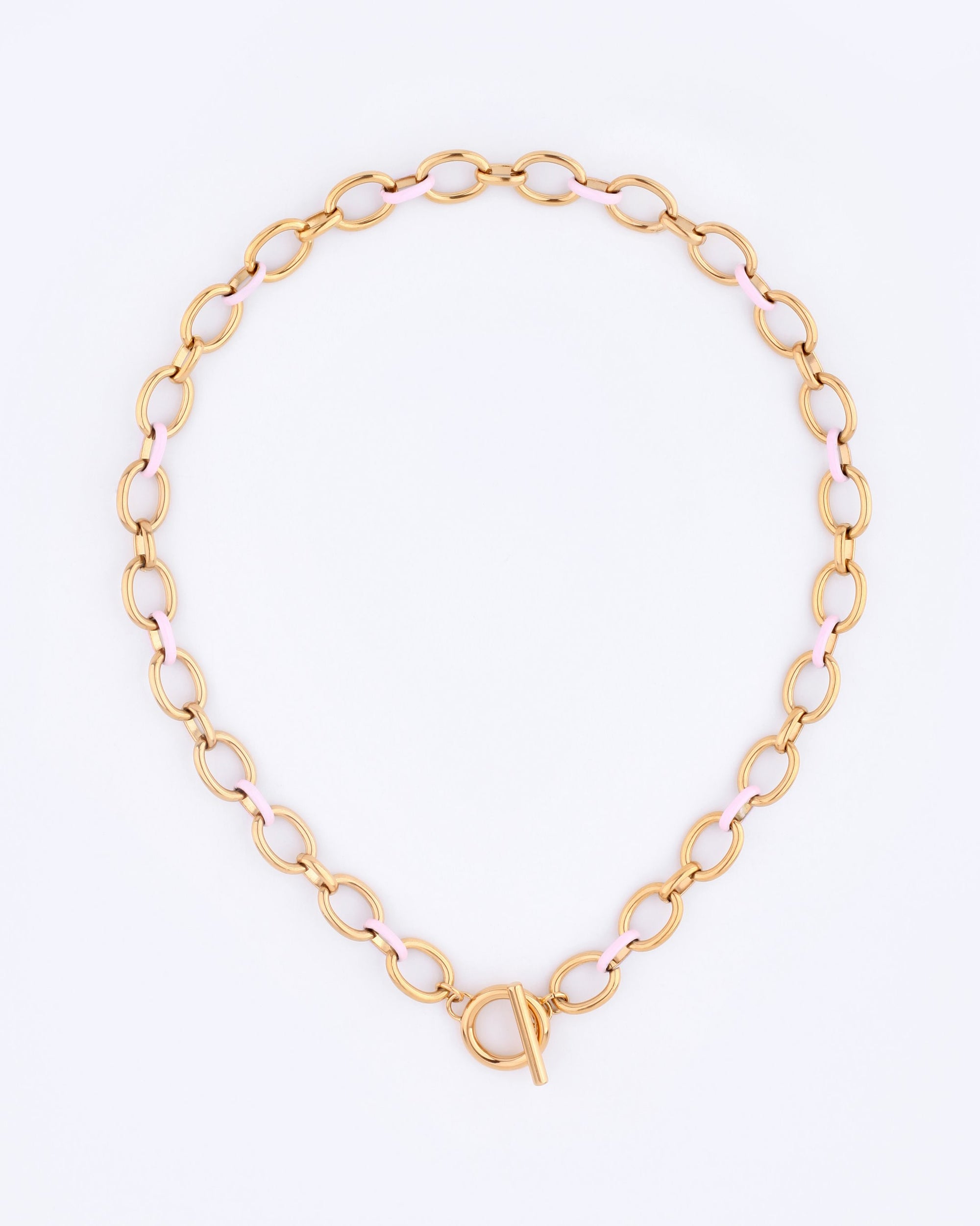 Part of the Love Letters collection by For Art's Sake®, the Raya Necklace showcases a bold wide link chain with an alternating pattern of gold and pink links, finished with a round toggle clasp, set against a plain white background.