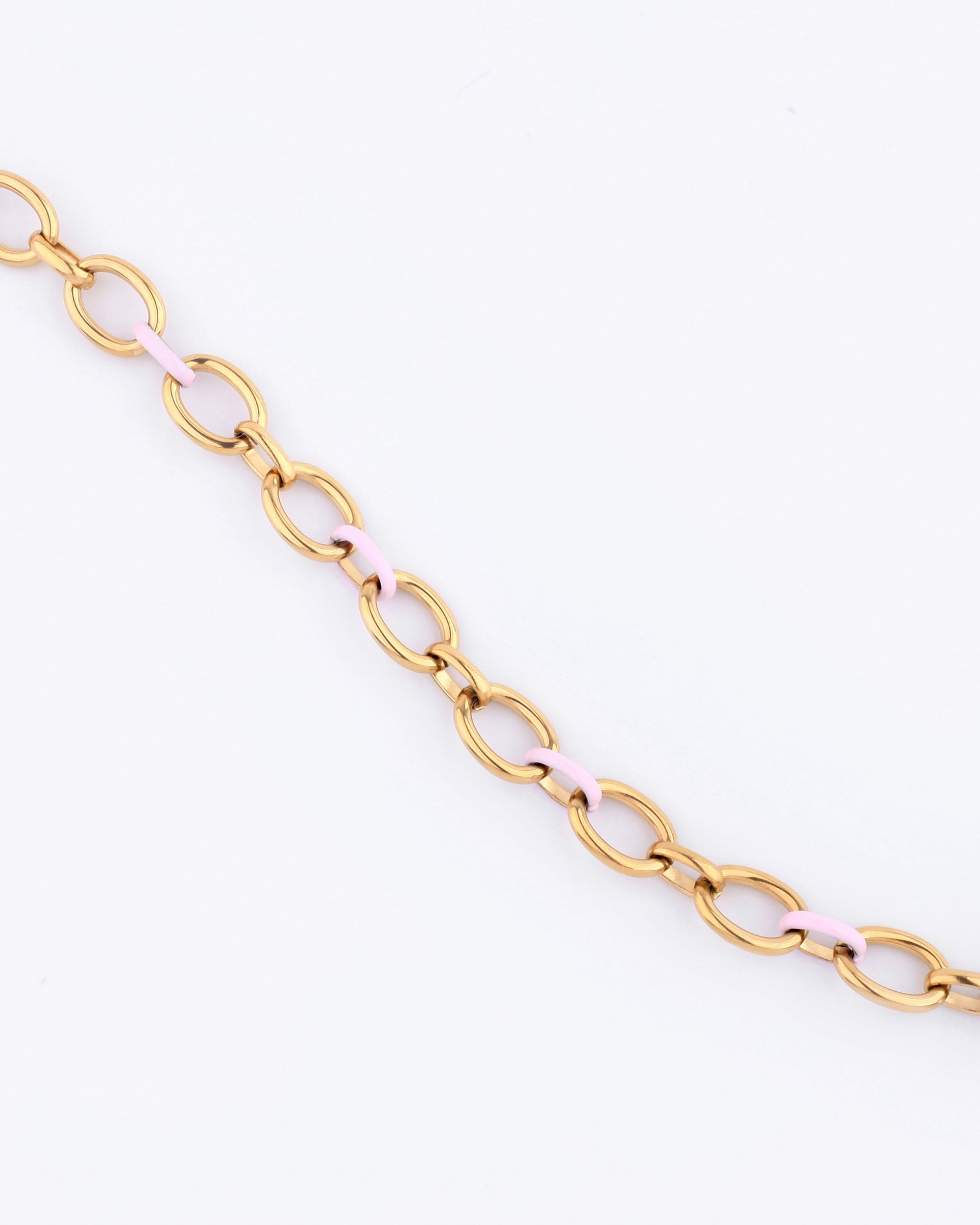 Introducing the Raya Necklace by For Art&#39;s Sake®, a stunning 24-karat gold chain featuring oval links and alternating light pink segments, elegantly showcased against a plain white background. This statement piece is perfect for adding a touch of sophistication to any outfit.