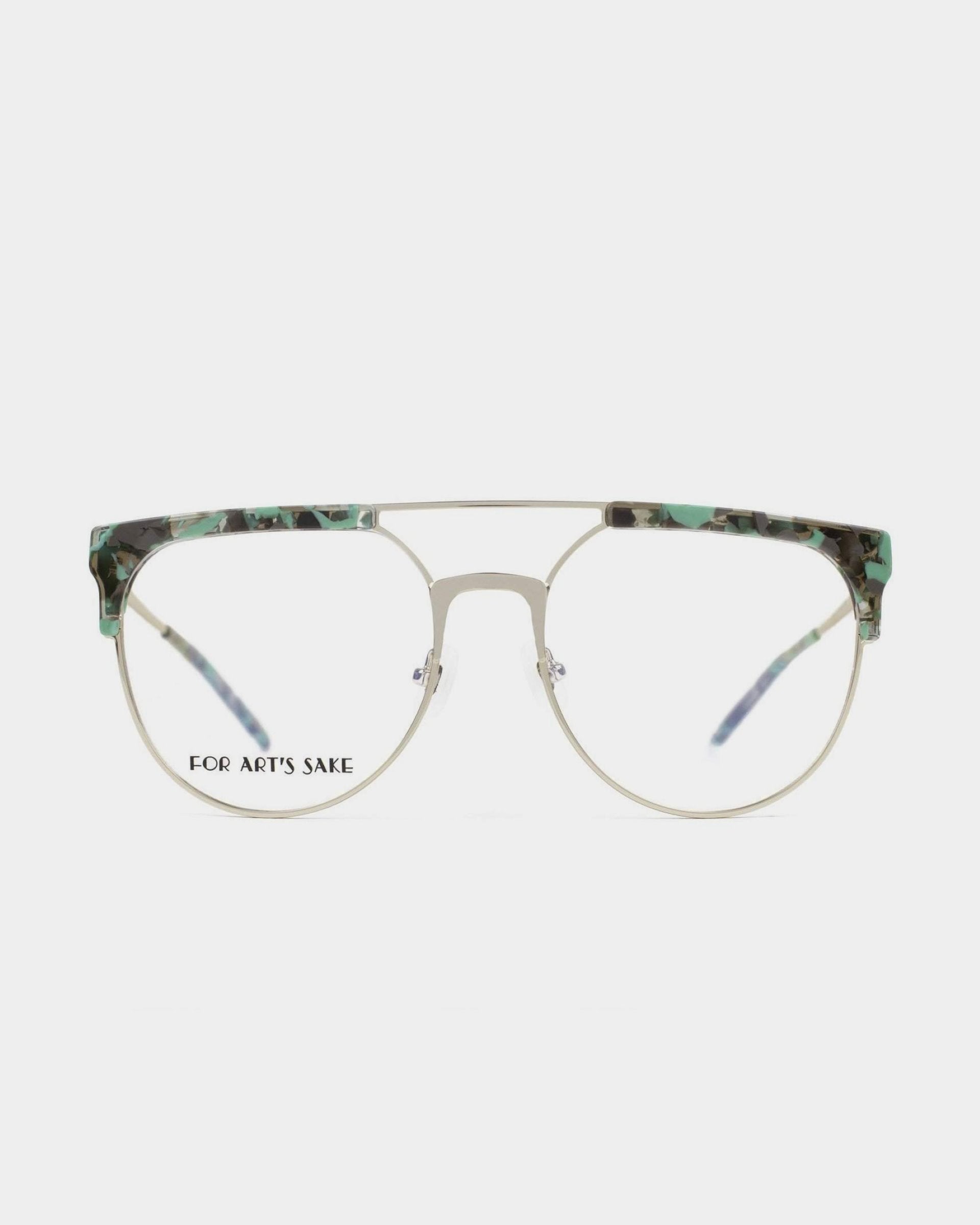 A pair of Frosty prescription glasses from For Art&#39;s Sake® with a green tortoiseshell pattern on the brow bar and temple tips. The frame boasts a double bridge design and clear lenses with UV protection. The text &quot;FOR ART&#39;S SAKE&quot; is visible on the left lens against a plain white background.