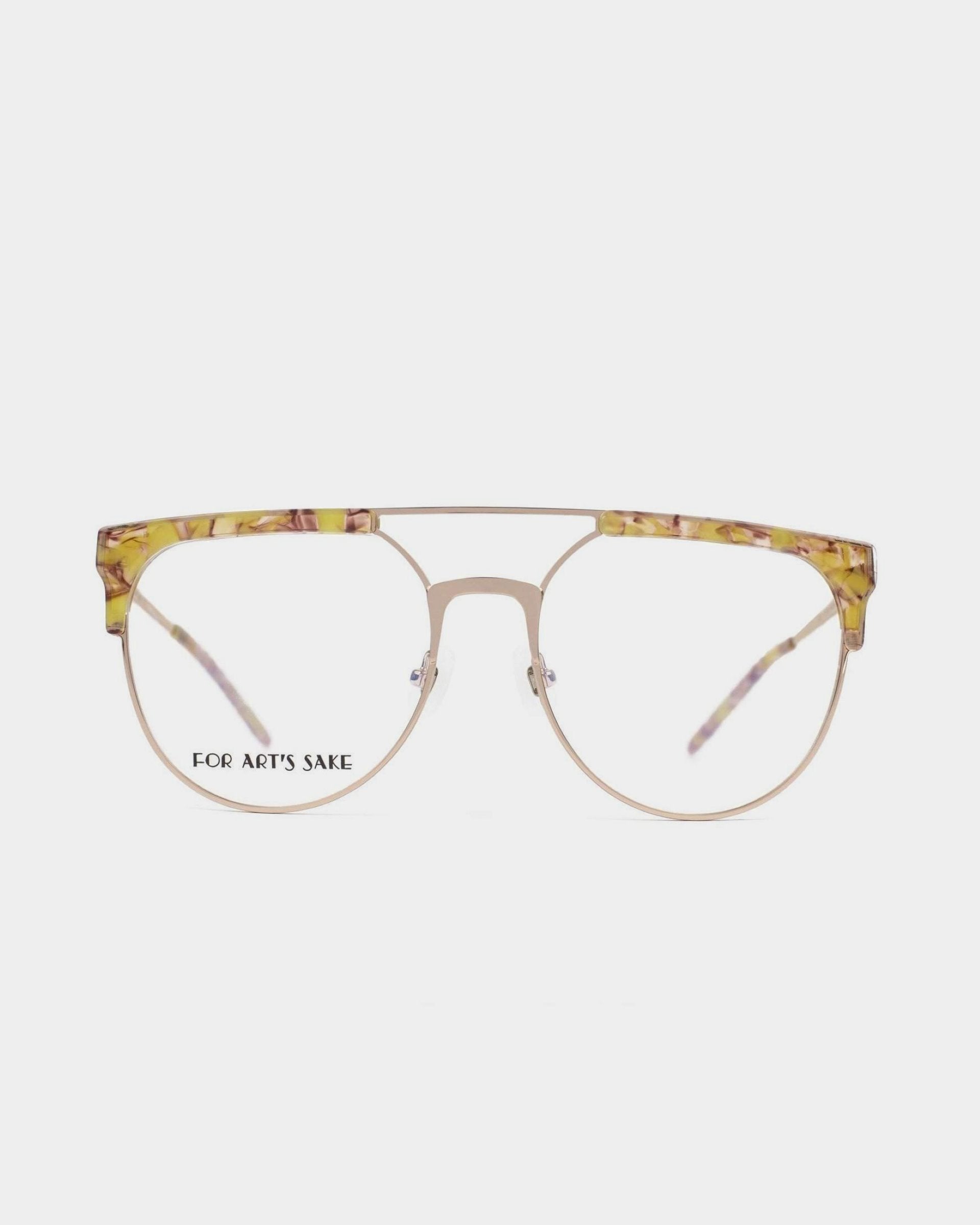 A pair of For Art's Sake® "Frosty" prescription glasses with a thin, gold metal frame and tortoise shell-patterned accents on the top part of the rims. The lenses are clear, with the left lens displaying "FOR ART'S SAKE." These chic glasses are also equipped with blue light filter technology. The background is plain white.