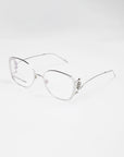 A pair of stylish, silver-framed Jupiter eyeglasses by For Art's Sake® with slightly oversized square lenses on a white background. The temples are thin and straight, with intricate decorative elements near the hinges. These chic glasses also feature a blue light filter for added comfort during screen time.