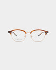 A pair of Painkiller eyeglasses by For Art's Sake® with brown and gold frames is displayed against a plain white background. The top half of the frames is a light brown color, while the bottom half is gold-colored. Featuring blue light filter lenses, the brand logo is visible on the left lens.