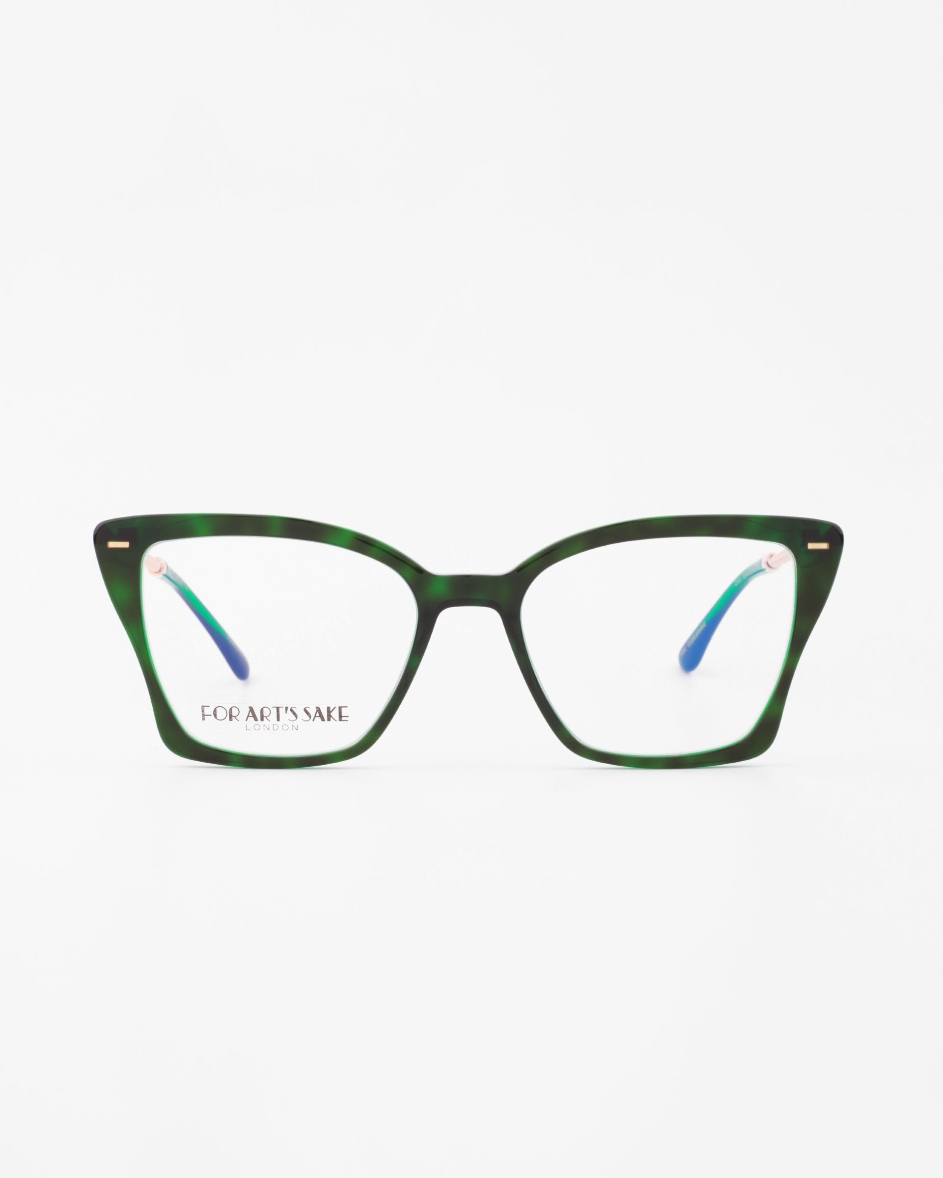 A pair of eyeglasses with dark green, horn-rimmed frames and rectangular lenses featuring blue light filter technology. The temples are blue with gold accents near the hinges, giving them an elegant touch. The brand &quot;For Art&#39;s Sake®&quot; is written on the left lens. The background is white.