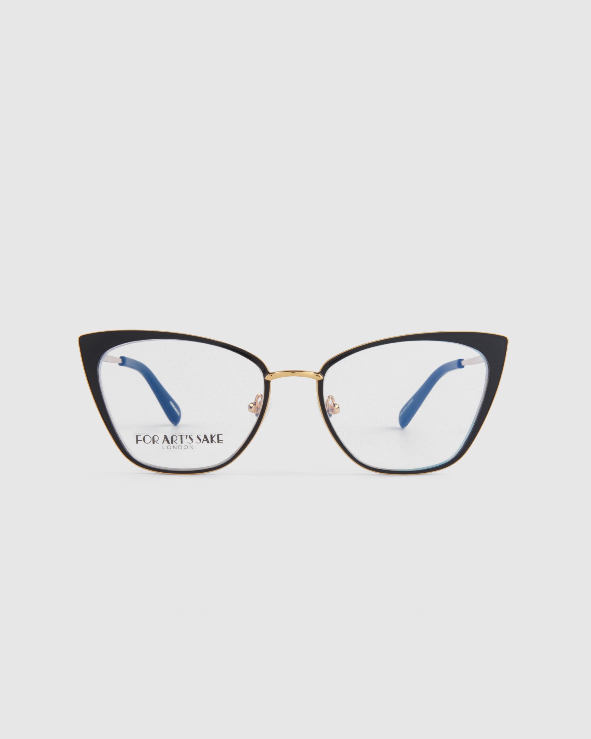 A pair of For Art's Sake® Stella Two stylish cat-eye glasses with black and 14kt gold-plated frames. The temples have a sleek design with blue ear tips. The lenses are clear and equipped with Blue Light Filter, and the words "FOR ART'S SAKE" are printed on the left lens. The background is plain white.