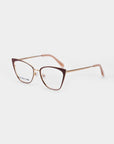 Introducing the Stella Two by For Art's Sake®: a pair of stylish eyeglasses with a brown and gold, 14kt gold-plated cat-eye frame. The temples are gold with light pink earpieces. The clear lenses feature a blue light filter, with the brand name subtly visible on the inside of the left lens. Set against a white background, these glasses combine elegance and functionality seamlessly.