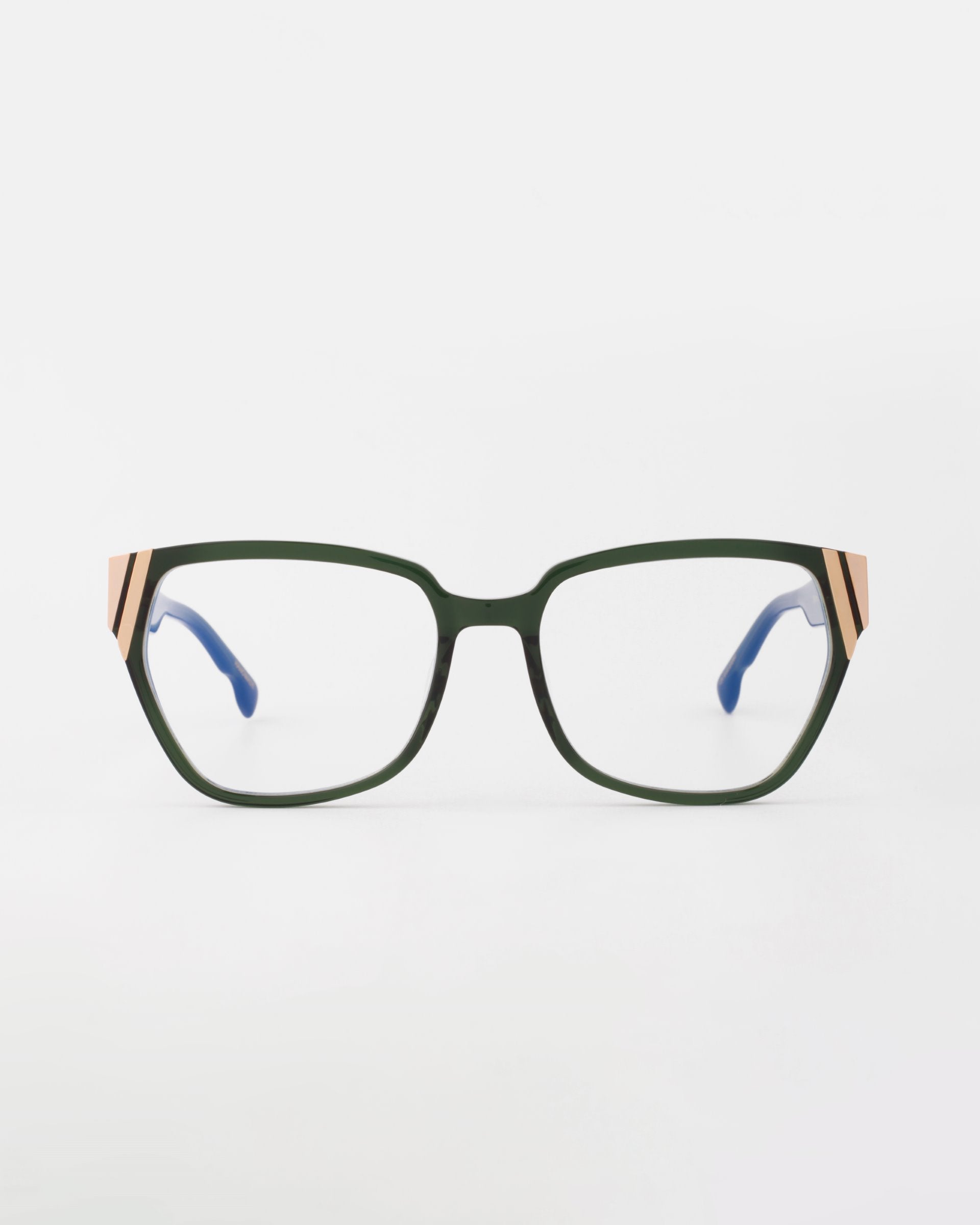 The Below Zero by For Art's Sake® features green rectangular eyeglasses with modern gold and black striped accents on the temples, set against a plain white background. This unisex style is completed with chunky blue acetate opticals.