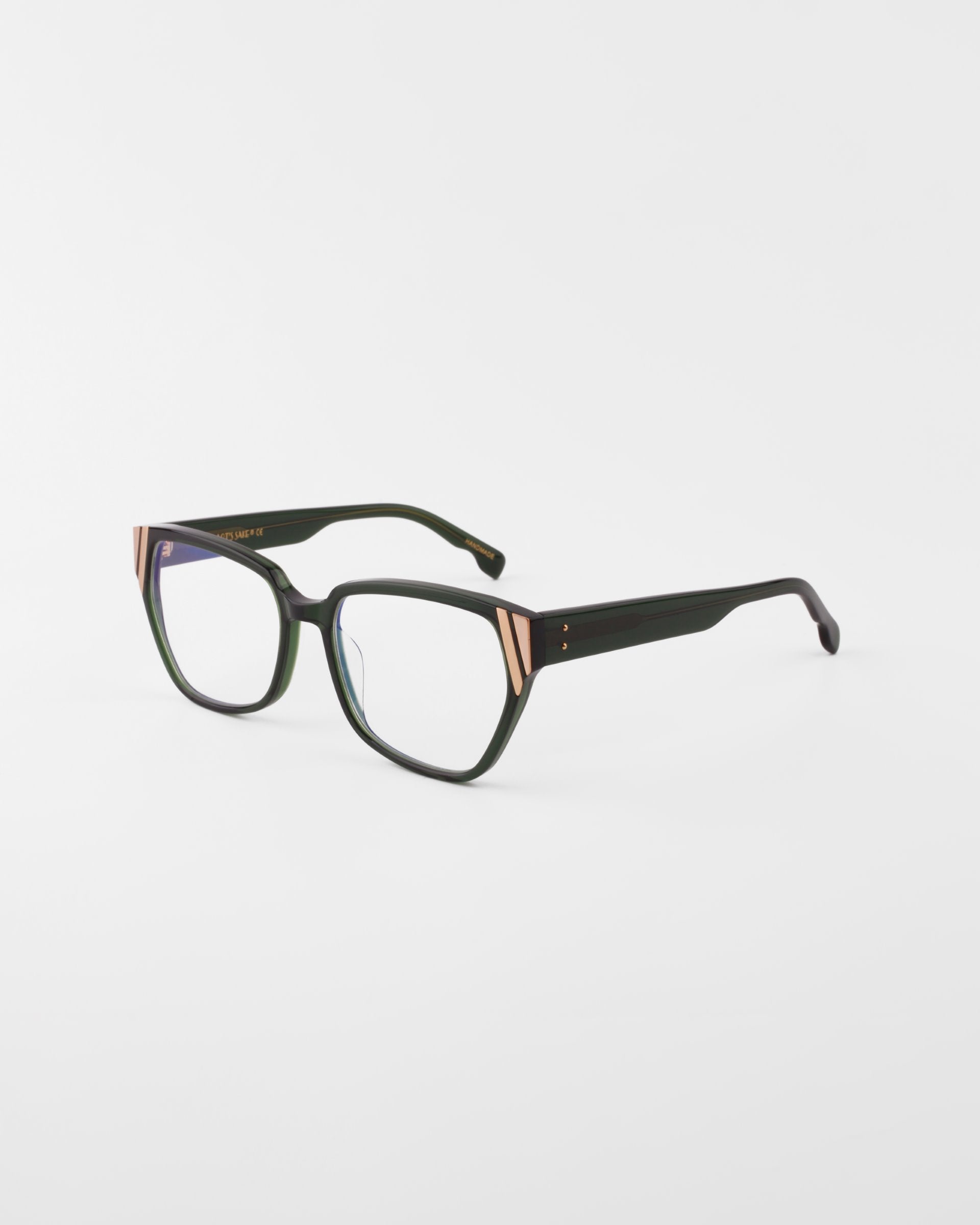 The Below Zero eyeglasses by For Art's Sake® showcase a unisex style with black square frames and gold temple accents. These chunky acetate glasses, set against a white background, offer a bold modern flair.