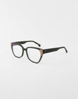 The Below Zero eyeglasses by For Art's Sake® showcase a unisex style with black square frames and gold temple accents. These chunky acetate glasses, set against a white background, offer a bold modern flair.