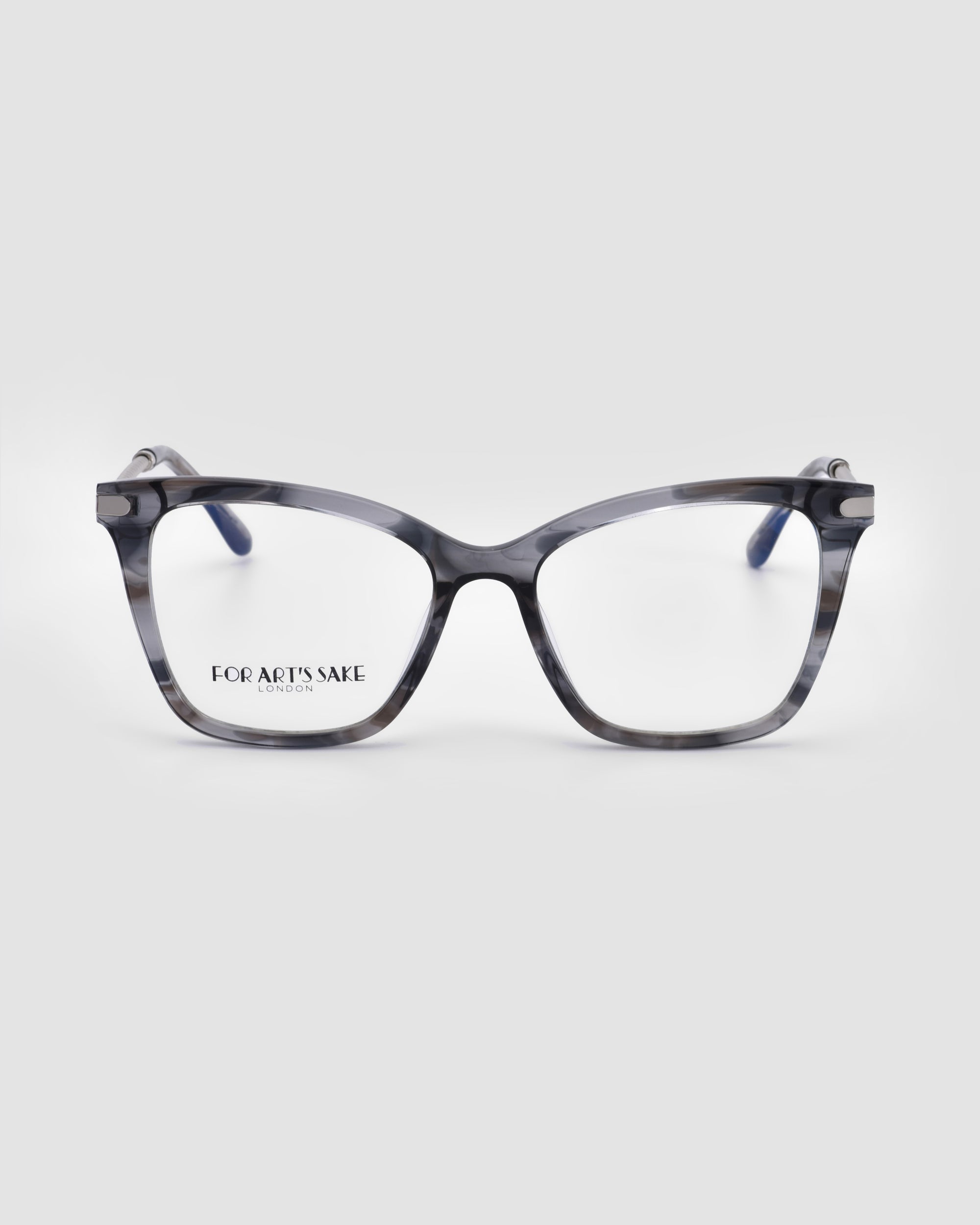 Introducing the Paris Two eyeglasses by For Art&#39;s Sake®, featuring a sleek black and grey marbled frame with clear lenses that incorporate advanced blue light filter technology. The &quot;FOR ART&#39;S SAKE&quot; text is elegantly visible on one of the lenses, all set against a minimalist, light grey backdrop.