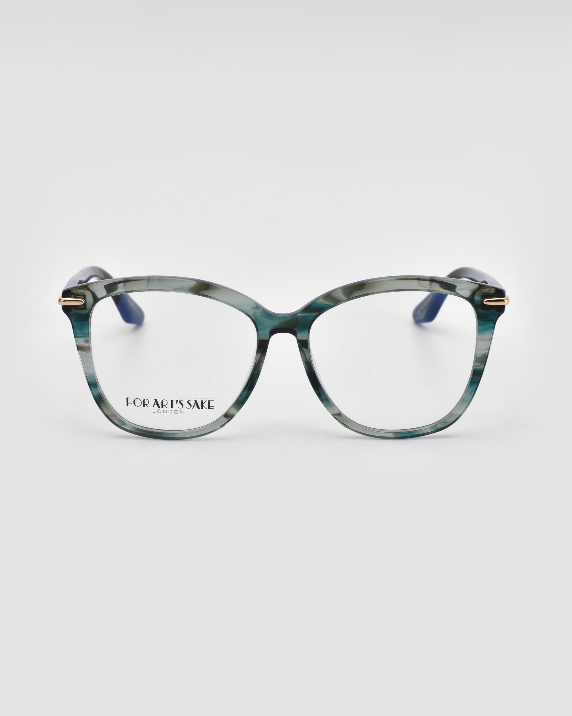 The Cadenza by For Art's Sake® features stylish optical glasses with thick, rectangular frames in a greenish marble pattern. The lenses are clear, and the temples are dark blue. The brand name "FOR ART'S SAKE" is visible on the left lens. Perfect for those seeking both fashion and prescription service, against a plain white background.