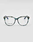 The Cadenza by For Art's Sake® features stylish optical glasses with thick, rectangular frames in a greenish marble pattern. The lenses are clear, and the temples are dark blue. The brand name "FOR ART'S SAKE" is visible on the left lens. Perfect for those seeking both fashion and prescription service, against a plain white background.