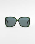 A pair of green, square-shaped Odyssey sunglasses by For Art's Sake® with dark tinted, lightweight nylon lenses against a plain white background. The frame features plant-based acetate with a subtle marbled pattern, adding a textured look.