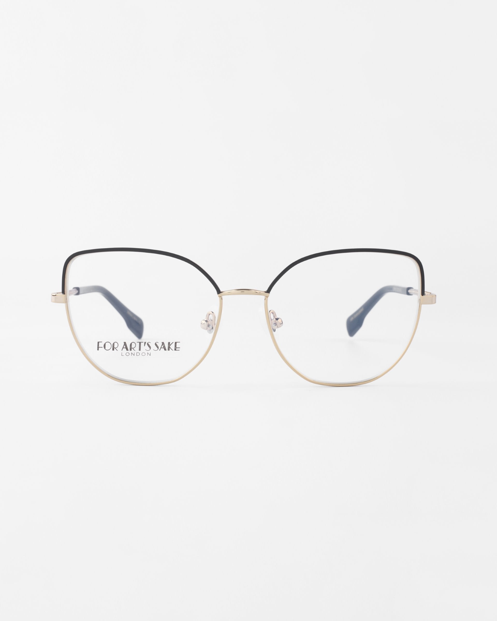 A pair of eyeglasses with a thin, gold metal frame and black rims on the top half of the lenses, featuring a subtle cat-eye silhouette. The product name &quot;Ophelia&quot; and brand name &quot;For Art&#39;s Sake®&quot; are printed on the left lens. The background is plain white.