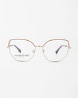 A pair of stylish, round eyeglasses with slender gold frames and brown-tinted upper rims. The clear lenses, featuring a slight cat-eye silhouette, come with a blue light filter. "For Art's Sake® Ophelia" is printed on the inside of the left lens. The background is plain white.