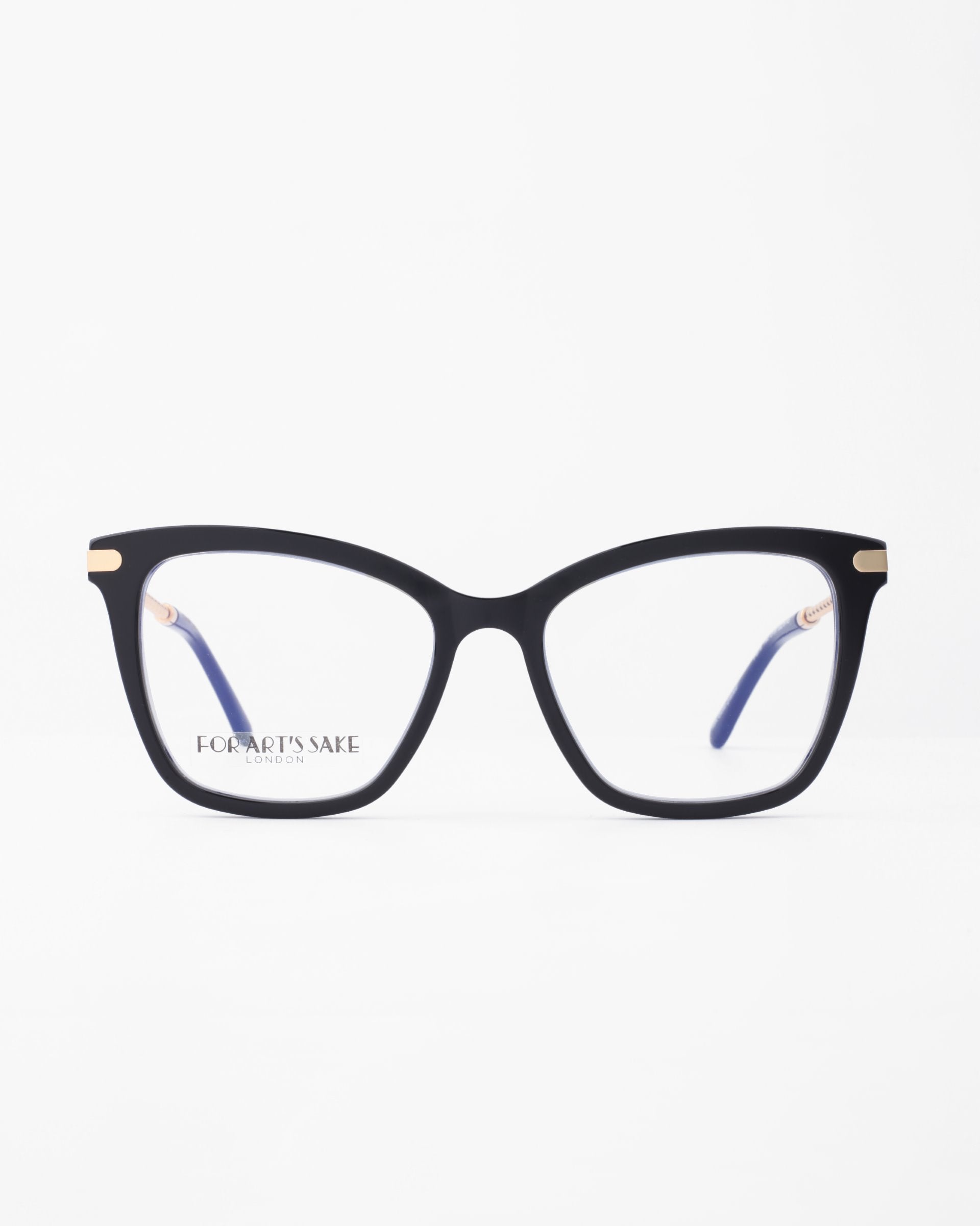 A pair of black, rectangular eyeglass frames with the brand name &quot;For Art&#39;s Sake®&quot; engraved on one of the lenses. The inner sides of the temples are blue, and the top corners feature small gold accents. These Paris Two frames include a blue light filter for added eye comfort. The background is plain white.